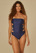 Body Thays Marinho azul marinho com alças removíveis e recortes laterais, modelo sorridente, fundo bege.
